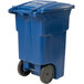 A blue Toter trash can with wheels.