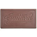 A brown rectangular Guittard chocolate bar with the words "Guittard French Vanilla 54% Dark Chocolate" in white.