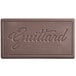 A brown rectangular Guittard chocolate bar with text that reads "Guittard"