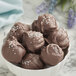 A bowl of Guittard milk chocolate truffles.