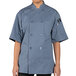A person wearing a Uncommon Chef short sleeve chef coat in blue.