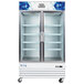 An Avantco white double glass door refrigerator with shelves.