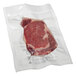 A piece of raw meat in a Hamilton Beach vacuum seal bag.