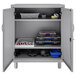 A Hirsh Industries platinum metal storage cabinet with tools inside.