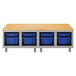 A Hirsh Industries natural wood rectangular worksurface with blue plastic bins on a shelf.