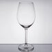 A Libbey wine glass with a clear surface on a table.