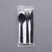 A black Eco-Products cutlery set in a plastic bag with a napkin.
