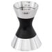 An OXO stainless steel double jigger with black and silver measurements.