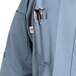 A Uncommon Chef Orleans long sleeve chef coat in steel grey with pen holders.