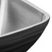 A close-up of a Vollrath stainless steel square beehive bowl.
