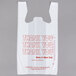A white plastic T-shirt bag with "Thank You" in red text.