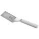 A Mercer Culinary Millennia square edge turner with a white handle.