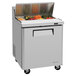 A Turbo Air stainless steel refrigerated sandwich prep table with vegetables in it.