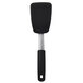 An OXO black silicone spatula with a black handle.