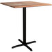 A Lancaster Table & Seating square wooden bar height table with a black base plate.