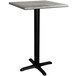 A Lancaster Table & Seating square counter height table with a black base and a gray top.