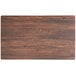 A rectangular wooden table top with a dark brown textured finish.