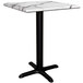 A white marble Lancaster Table with black legs.