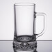 A Libbey clear glass beer mug with a handle.