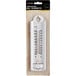 A Taylor white indoor/outdoor wall thermometer in a box.