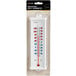 A Taylor utility wall thermometer with a white background and red numbers.