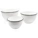 Three white Tablecraft enamel-coated steel mixing bowls with a black rim.