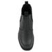 A Genuine Grip black leather boot with a rubber sole.