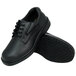 A pair of black Genuine Grip leather work shoes with black rubber soles.