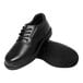 A pair of black leather Genuine Grip oxford shoes with black rubber soles.