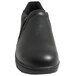 A close-up of a Genuine Grip black leather clog with a side zipper.