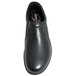 A close-up of a black Genuine Grip women's slip-on shoe with a rubber sole.