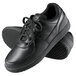 A pair of Genuine Grip black leather sport classic shoes with laces.