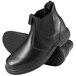 A pair of Genuine Grip men's black leather boots with white stitching.