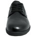 A black full grain leather Genuine Grip women's shoe with laces and a rubber sole.