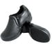 A pair of Genuine Grip black leather clogs with a zipper.