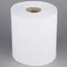 A Merfin white center pull paper towel roll on a white surface.