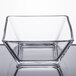 A clear square glass bowl.