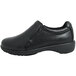 A Genuine Grip black slip-on leather shoe with a rubber sole.
