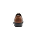 The back of a brown Shoes For Crews Senator dress shoe with a black sole.