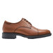 A brown leather Shoes For Crews Senator dress shoe with a black sole.