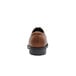 The back of a brown leather Shoes For Crews Senator dress shoe with a black sole.