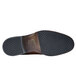 The brown sole of a Shoes For Crews Senator dress shoe.