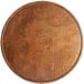 A Lancaster Table & Seating round wooden table top with a vintage finish.