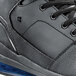 A close up of a black Shoes For Crews Tigon men's athletic shoe.