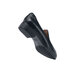 A black Shoes For Crews women's dress shoe with rubber soles.