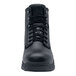A close-up of a black Shoes For Crews work boot with laces.