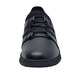 A black Shoes For Crews Karina athletic shoe with laces.