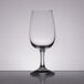 A close up of a clear Stolzle INAO wine glass.