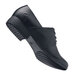 A black Shoes For Crews Madison III dress shoe with rubber soles.