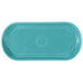 A turquoise rectangular Fiesta bread tray with a circular design in the middle.
